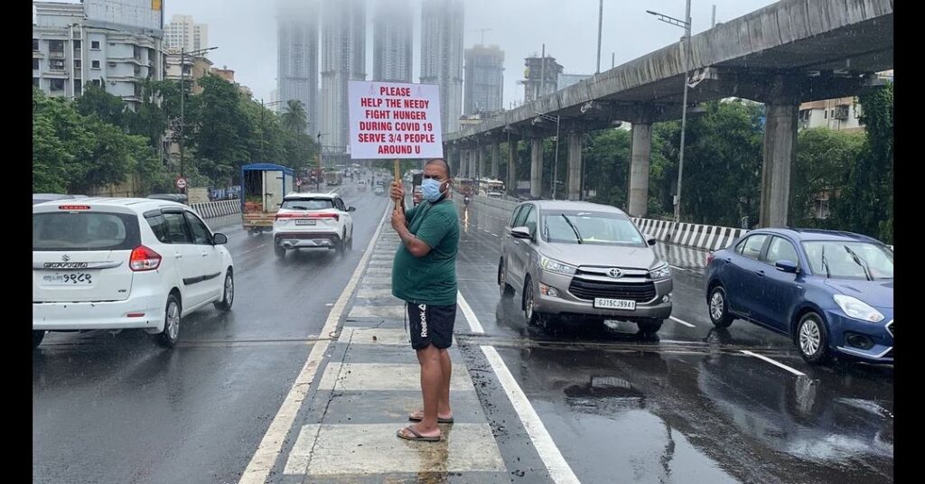 Mauris Bhai with banner- Help the needy